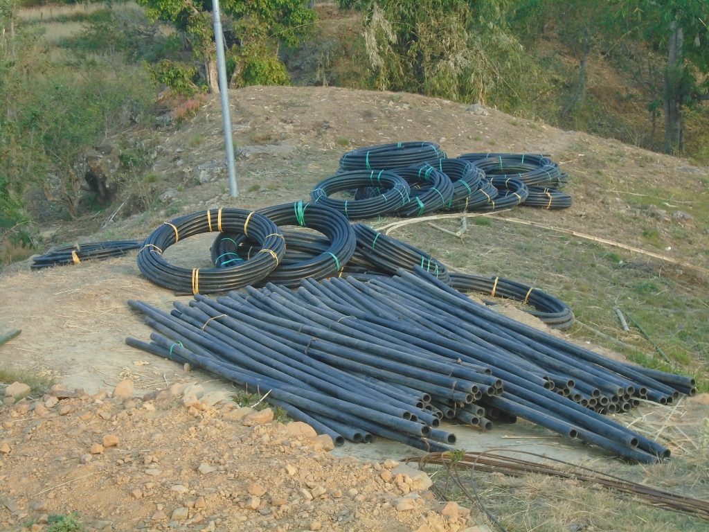 Rolls of water pipe on the ground