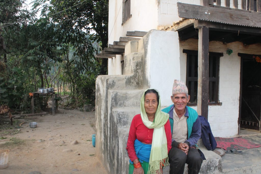 Man Bahadur and Sita Mahatra sitting outside their house